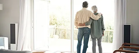 Photo of a couple looking out the window