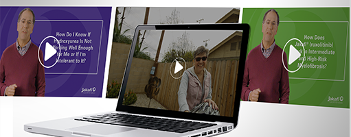 Image of laptop open with a video on the screen.