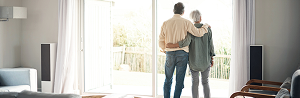 Photo of a couple looking out a window