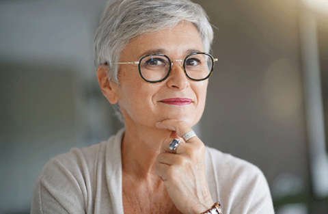 Image of a grey-haired woman smiling